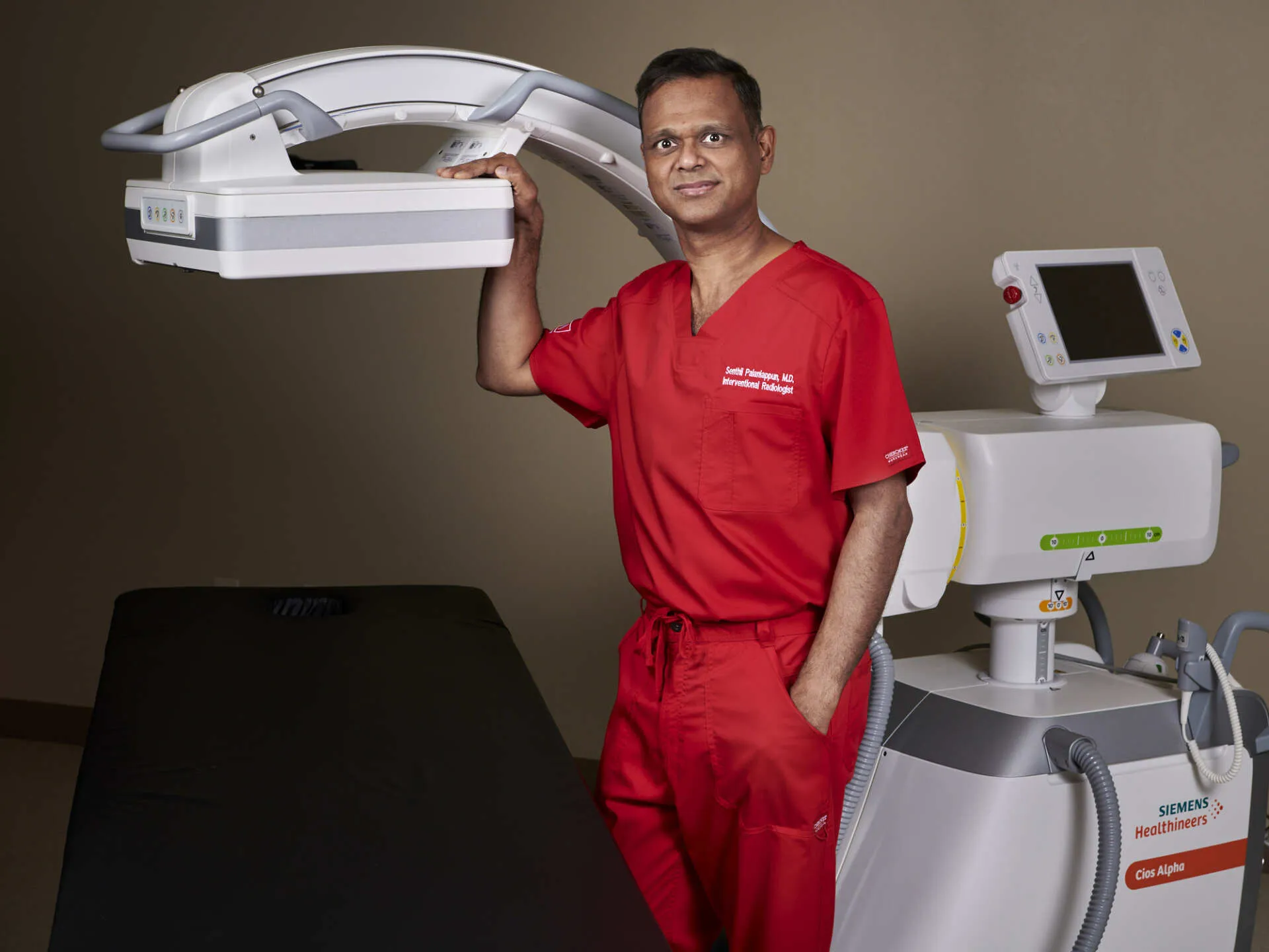 Dr. Senthil Palaniappun beside imaging equipment in the Mara procedure suite